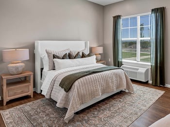 An assisted living apartment bedroom at Cedarhurst Senior Living of Shawnee