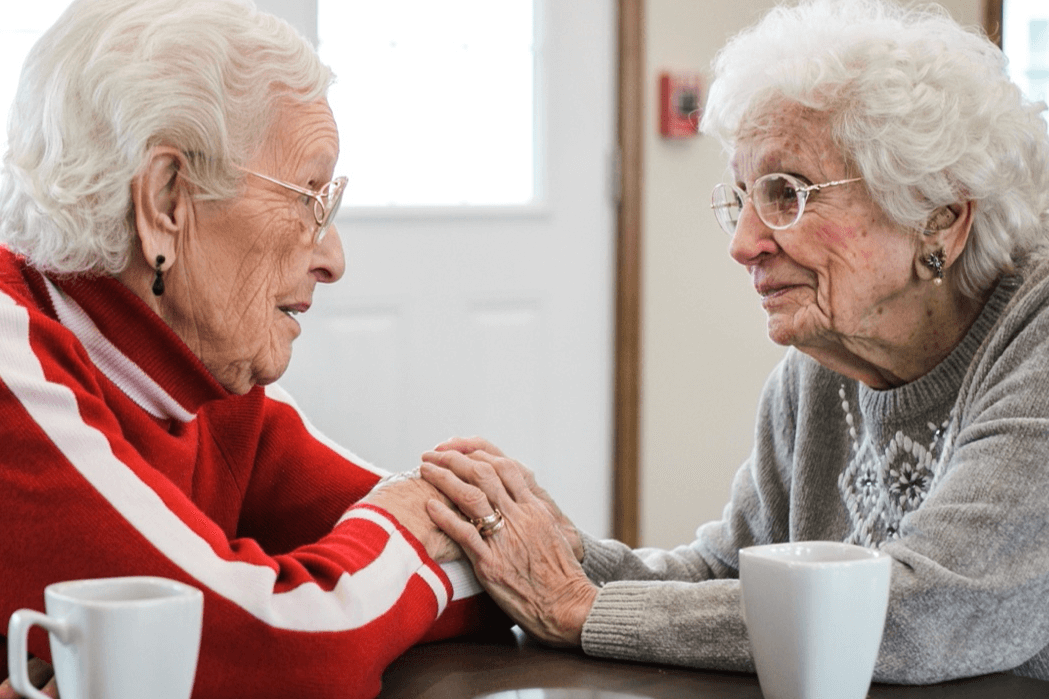 senior woman chatting while having coffee