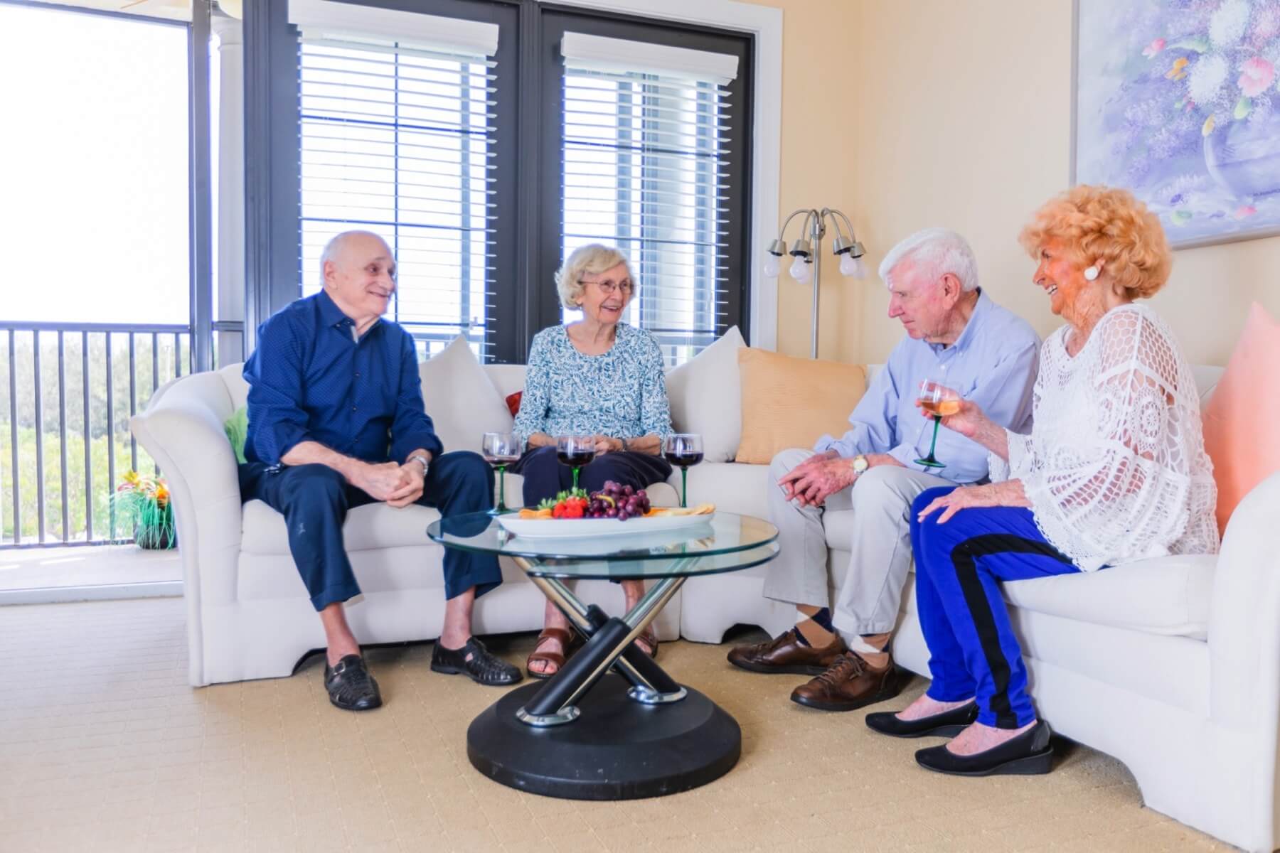 seniors sitting together in living room