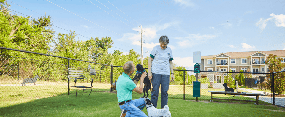 seniors with dogs in the pet designated area
