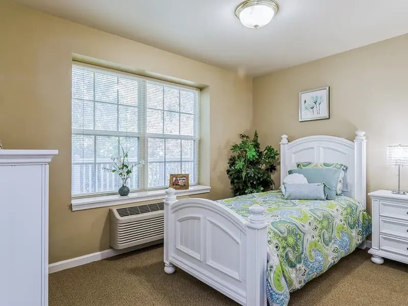 Bedroom of a senior apartment at Cedar Creek of Fort Wayne, designed for comfort and personalization