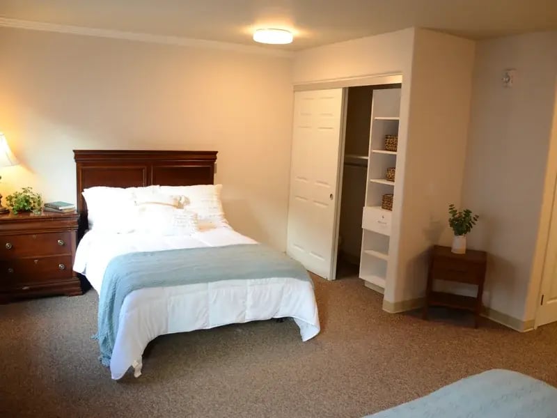 Bedroom of a senior apartment at Cedar Creek of High Plains, designed for comfort and personalization