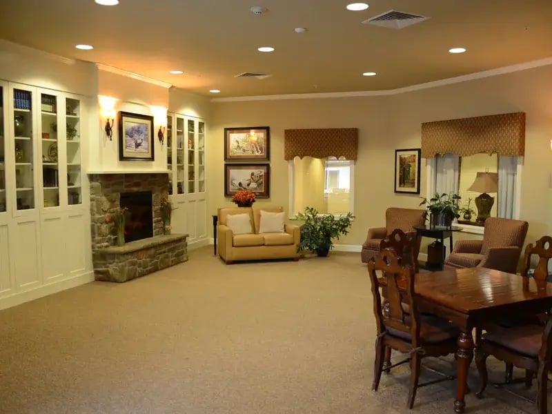 Cedar Creek of High Plains' cozy common area, complete with a warm fireplace and comfortable seating