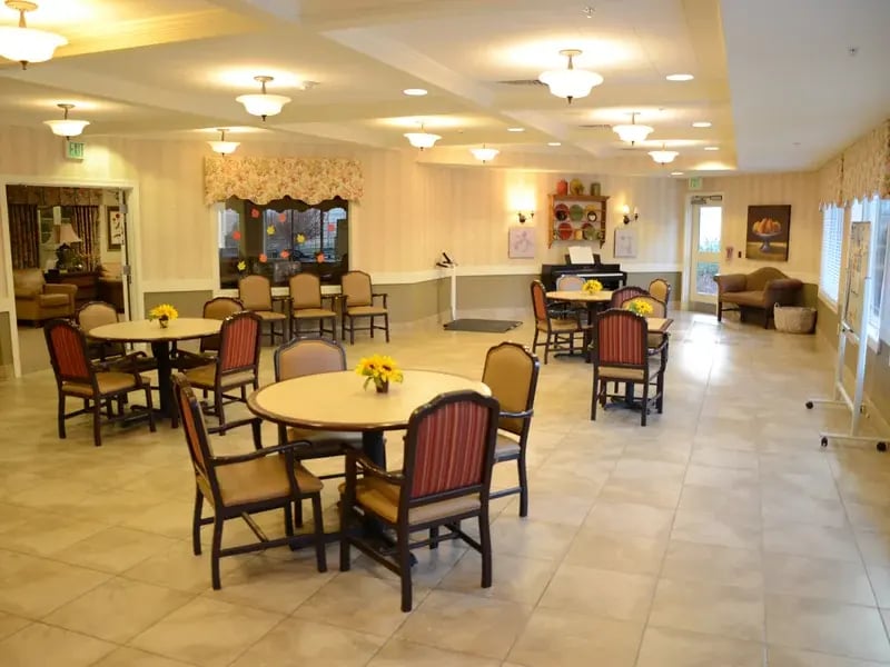 Common area—complete with a piano and ample seating—where residents can enjoy music and relaxation