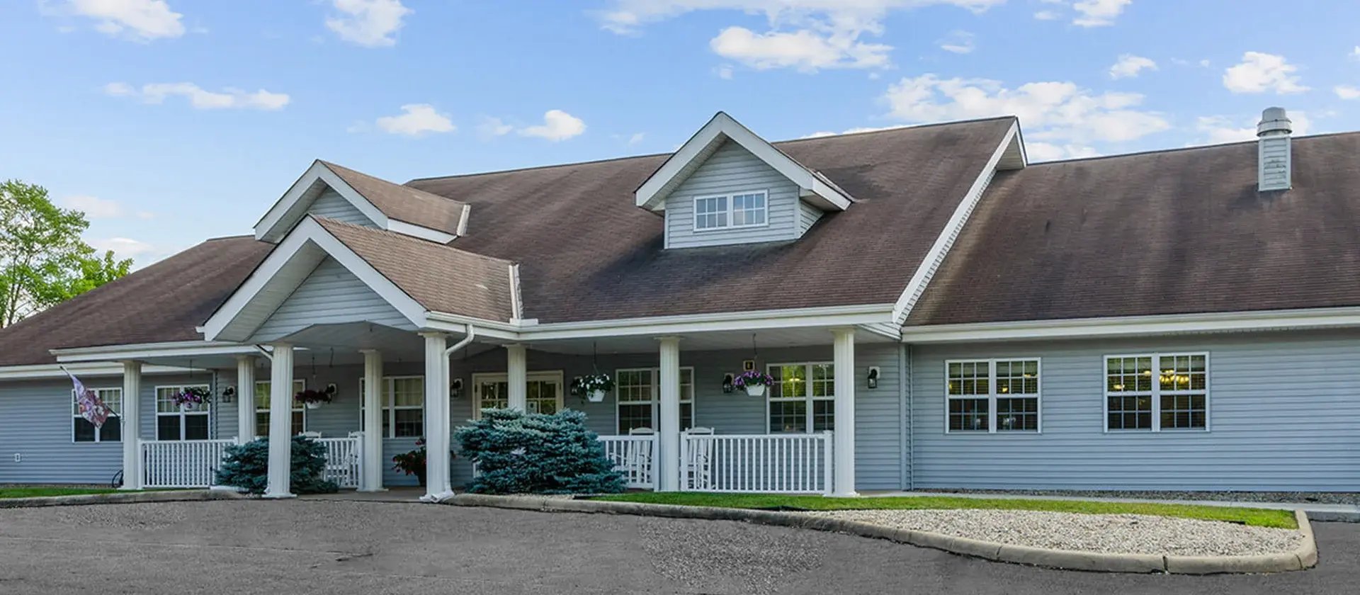 The welcoming front exterior of Cedar Creek of Logansport senior living community
