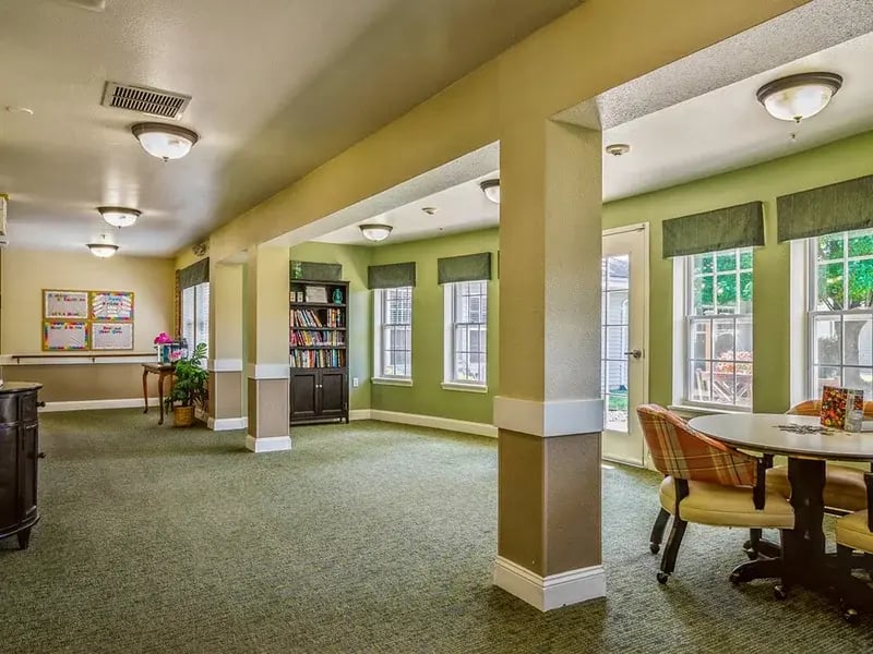 Cedar Creek of Logansport's welcoming senior-friendly common area with accessible resources for reading and relaxation