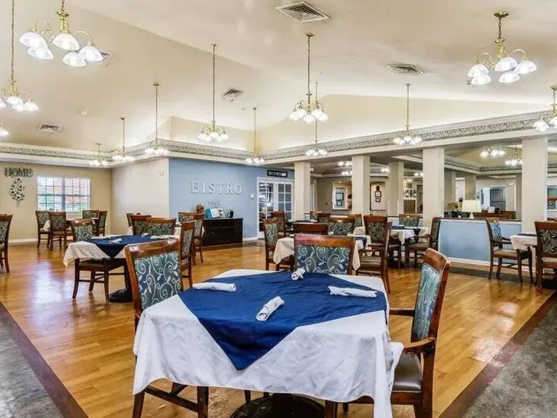 A spacious and bright bistro room at Cedar Creek of Marion, offering comfortable seating for meals