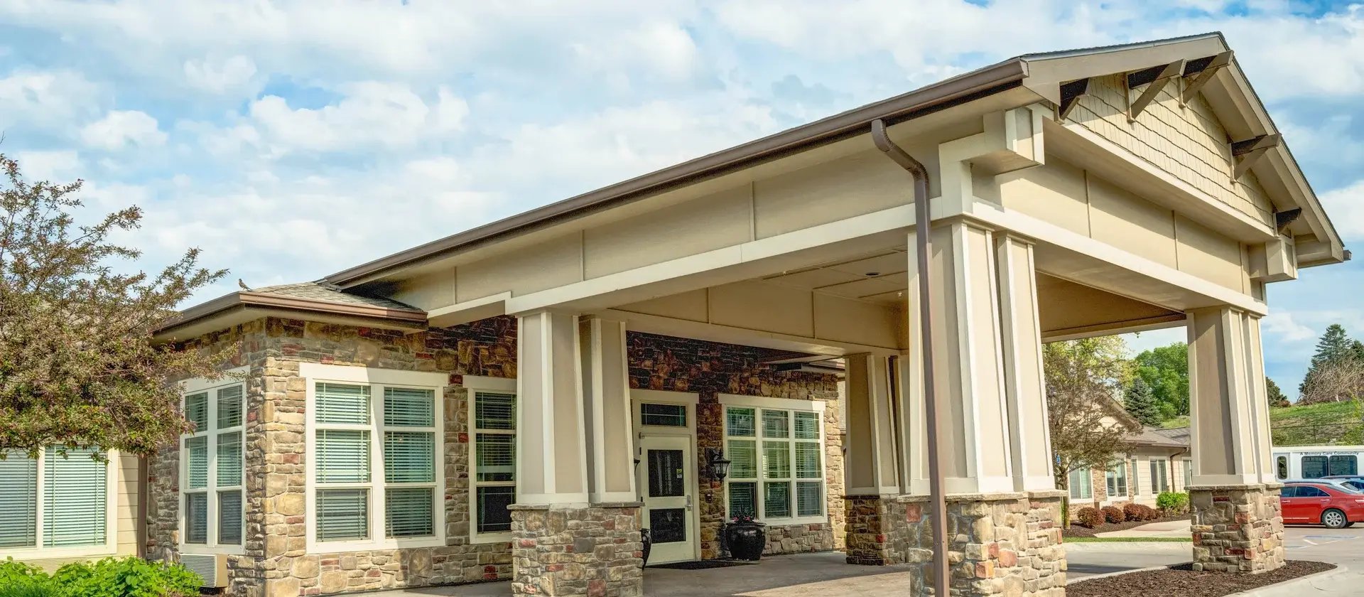 The welcoming front exterior of Cedar Creek of Prairie Meadows senior living community