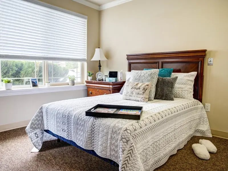 Bedroom of a senior apartment at Cedar Creek of Prairie Meadows, designed for comfort and personalization