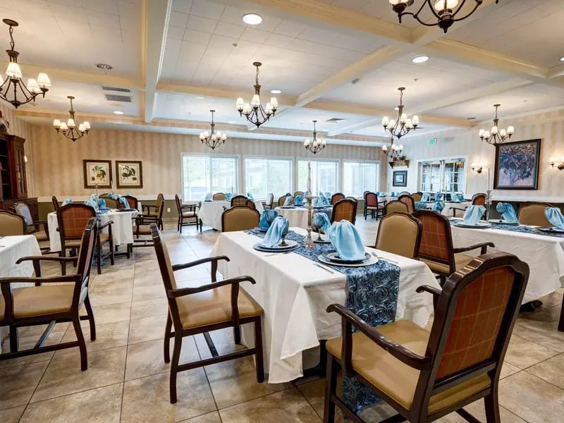 Another elegant dining space at Cedar Creek of Prairie Meadows, offering comfortable, accessible seating for resident meals