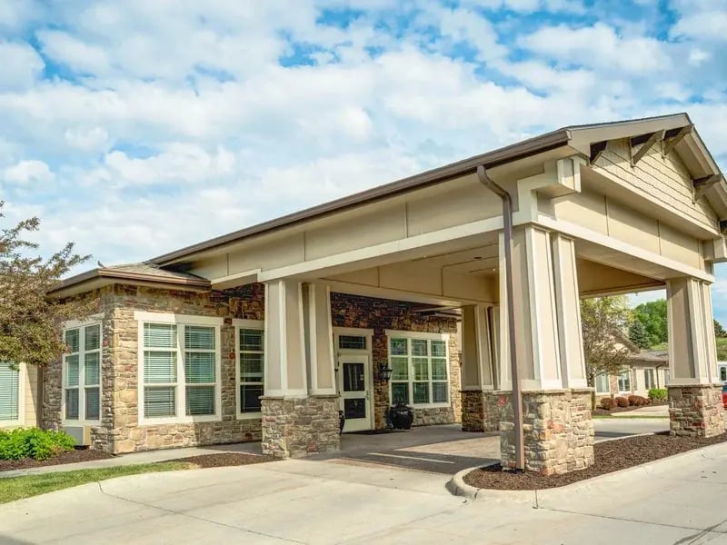 The welcoming front exterior of Cedar Creek of Prairie Meadows senior living community