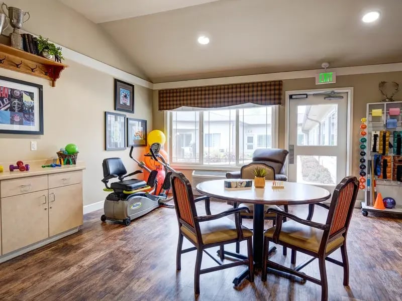 The dedicated physical therapy room at Cedar Creek of Prairie Meadows, equipped with accessible equipment for resident rehabilitation and wellness