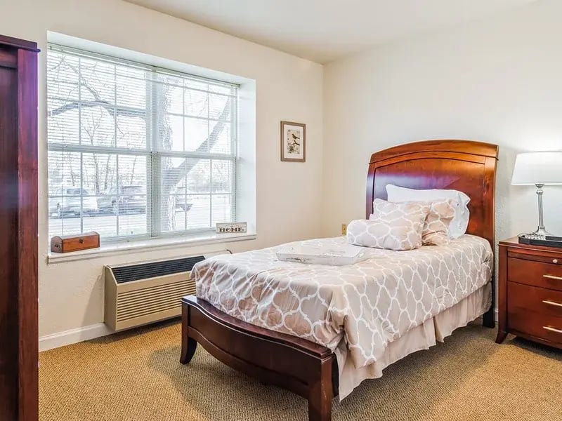Bedroom of a senior apartment at Cedar Creek of Warsaw, designed for comfort and personalization