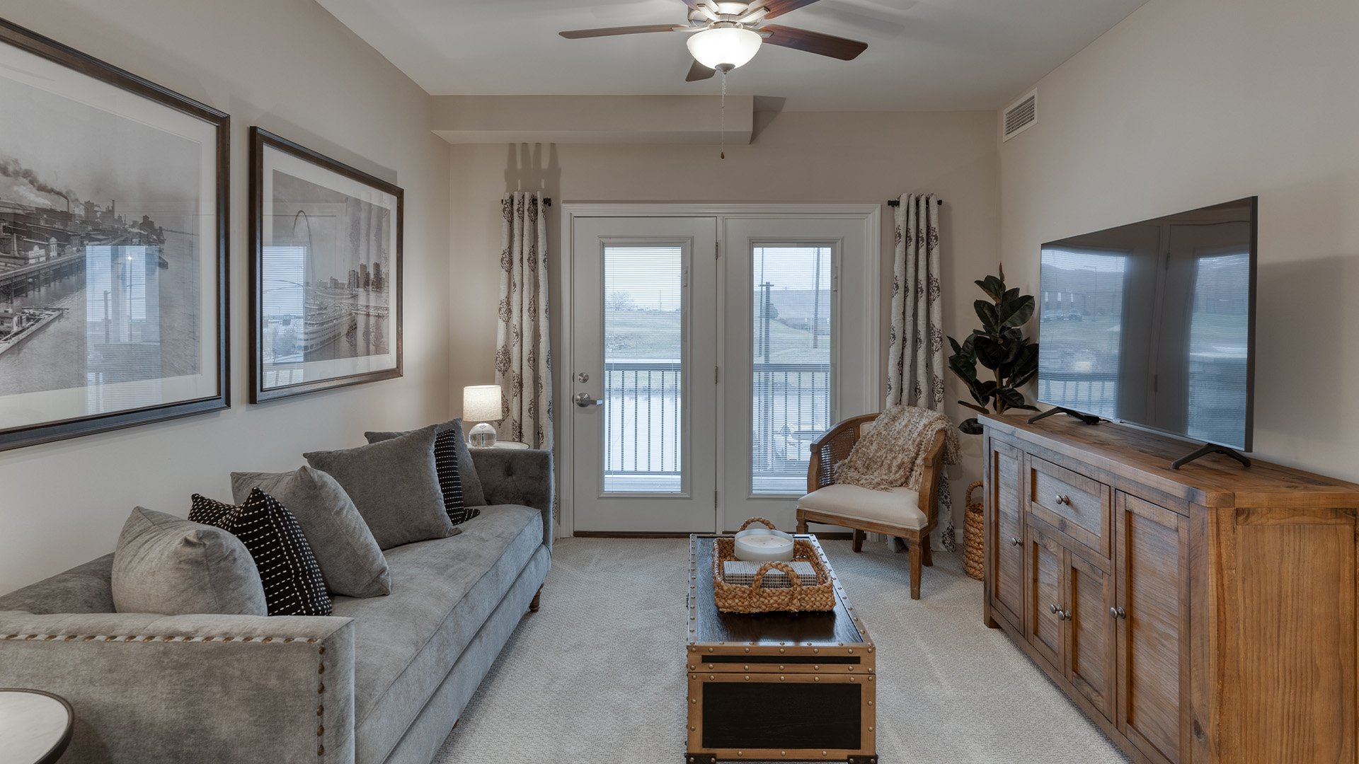 A spacious and bright living room inside a senior apartment at Cedarhurst of Arnold