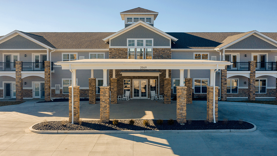 The inviting front exterior of the Cedarhurst of Arnold senior living community building