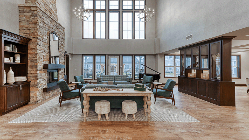 Cedarhurst of Arnold's welcoming common area, complete with comfortable furniture and a warm fireplace for relaxation and socialization