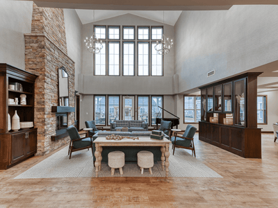 Cedarhurst of Arnold's welcoming common area, complete with comfortable furniture and a warm fireplace for relaxation and socialization