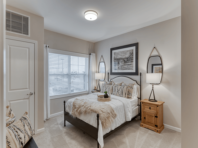 Bedroom of a senior apartment at Cedarhurst of Arnold, designed for comfort and personalization