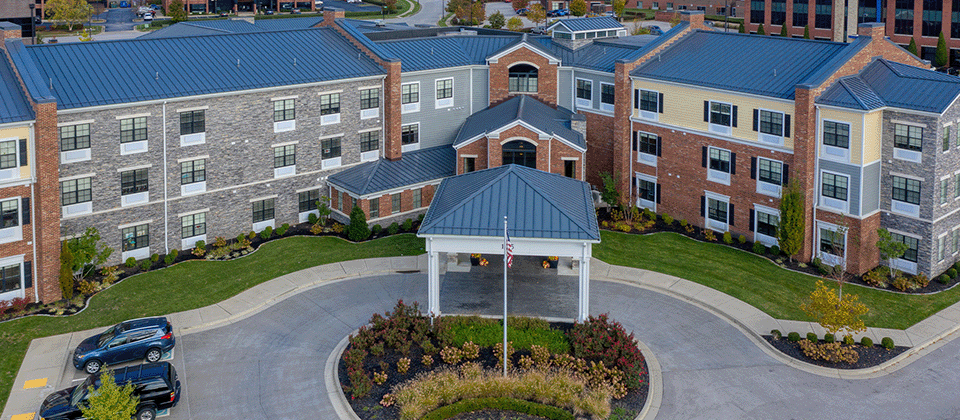 The inviting front exterior of the Cedarhurst of Beaumont senior living community building.