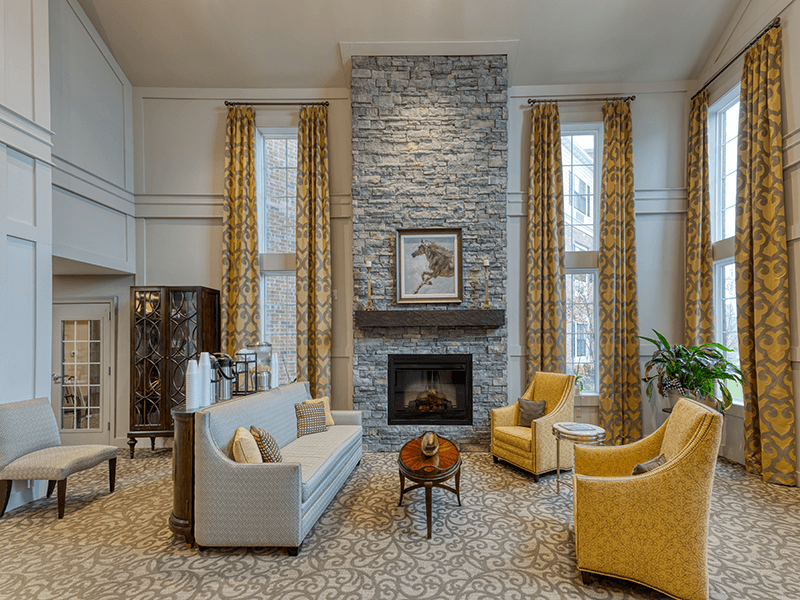 Cedarhurst of Beaumont's welcoming common area, complete with comfortable furniture and a warm fireplace for relaxation and socialization.