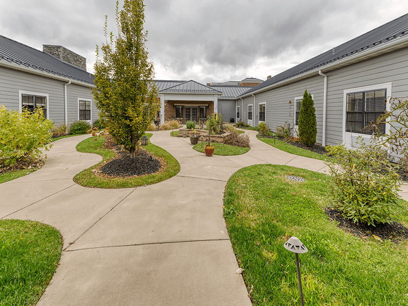The beautiful outdoor gardens at Cedarhurst of Beaumont, featuring raised beds designed for easy and accessible gardening.