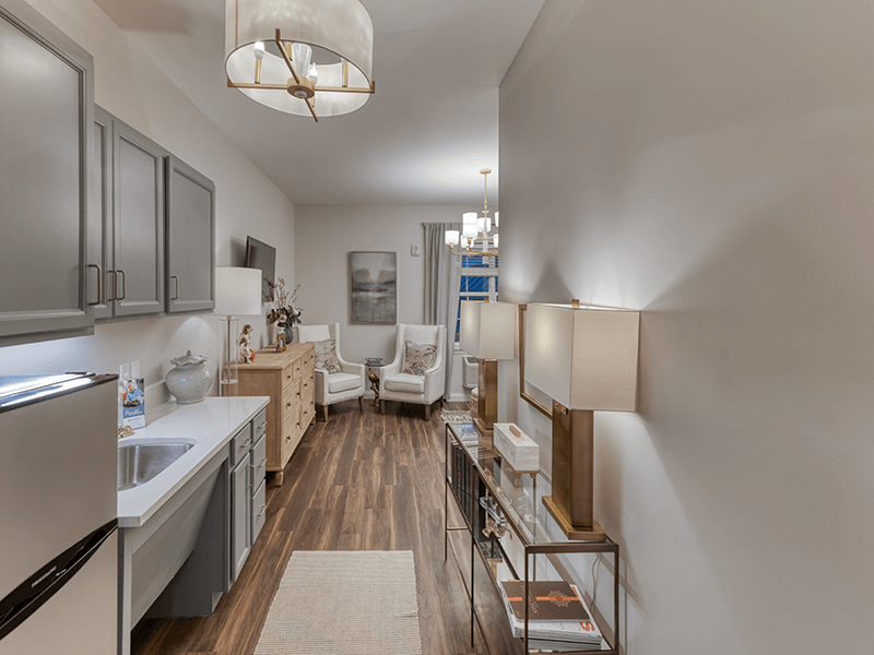 An accessible kitchenette in a senior apartment at Cedarhurst of Beaumont, designed for ease of use and independence.
