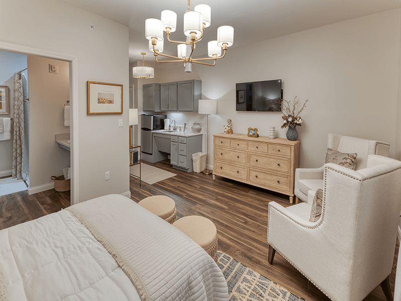 A spacious and bright living room inside a senior apartment at Cedarhurst of Beaumont.