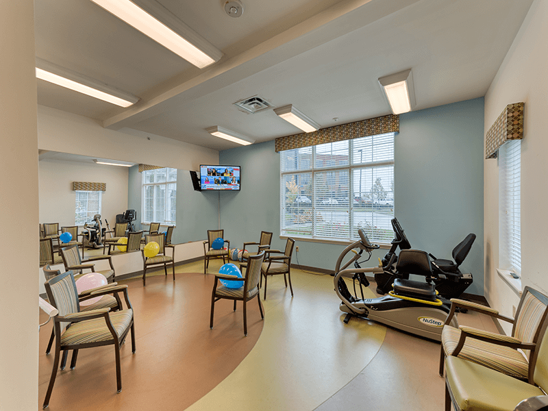 The dedicated physical therapy room at Cedarhurst of Beaumont, equipped with accessible equipment for resident rehabilitation and wellness.