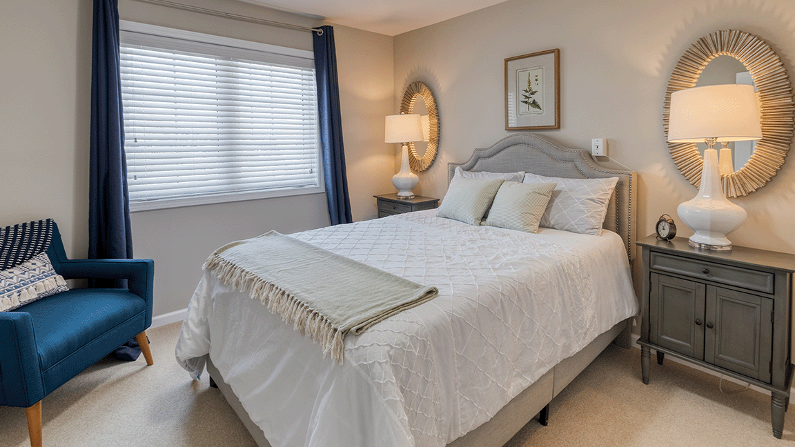 Bedroom of a senior apartment at Cedarhurst of Bethalto, designed for comfort and personalization.
