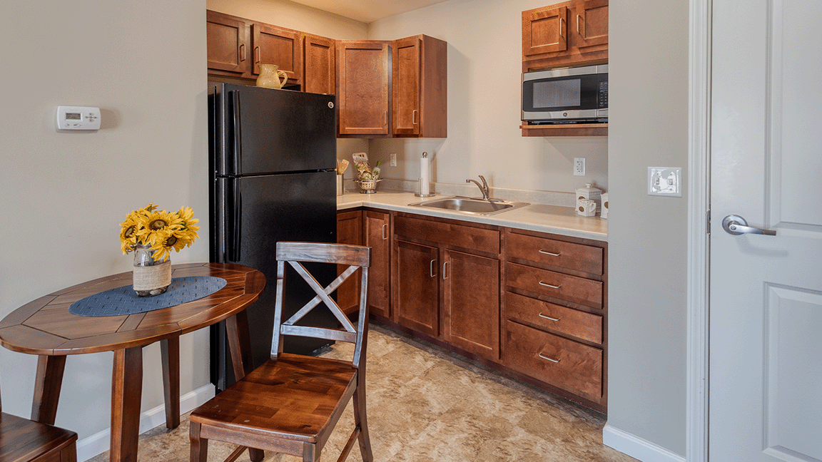 An accessible kitchenette in a senior apartment at Cedarhurst of Bethalto, designed for ease of use and independence.