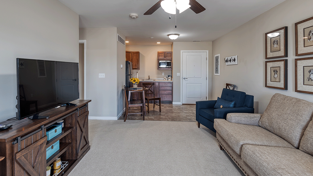 A spacious and bright living room inside a senior apartment at Cedarhurst of Bethalto