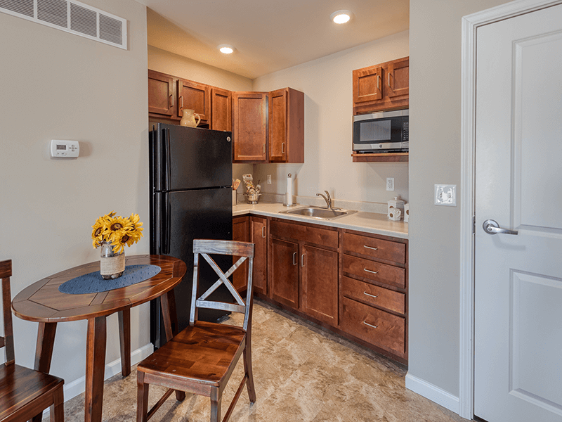 An accessible kitchenette in a senior apartment at Cedarhurst of Bethalto, designed for ease of use and independence.