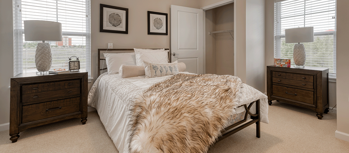 Bedroom within a senior apartment at Cedarhurst of Blue Springs, designed for personal comfort.