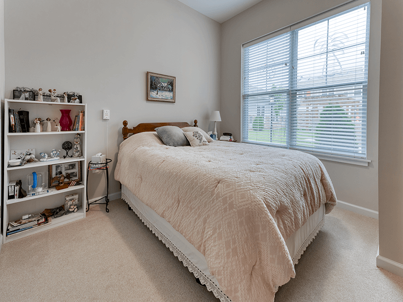 Bedroom of a senior apartment at Cedarhurst of Blue Springs, designed for resident comfort and personalization.