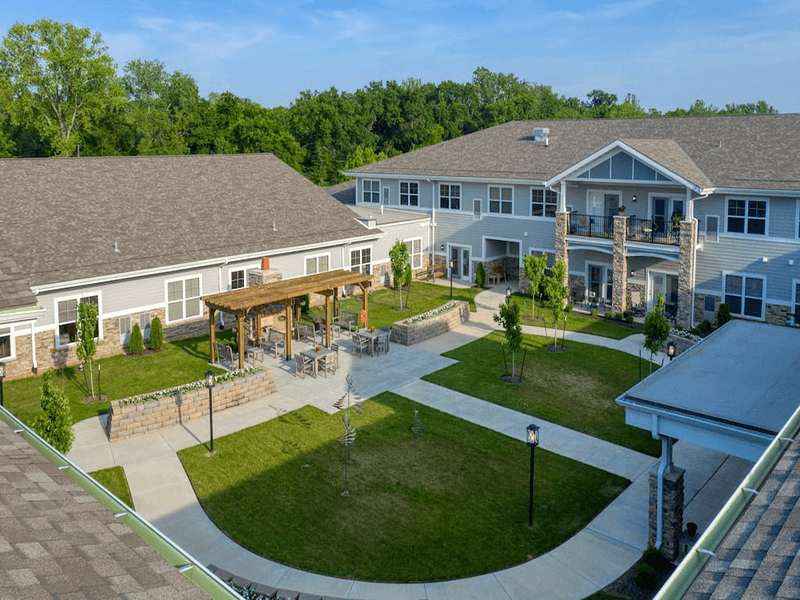 Shaded outdoor area at Cedarhurst of Blue Springs, complete with a beautiful pergola for comfort and relaxation
