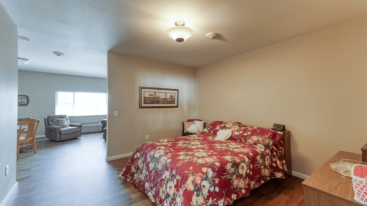 Bedroom of a senior apartment at Cedarhurst of Breese, designed for resident comfort and personalization