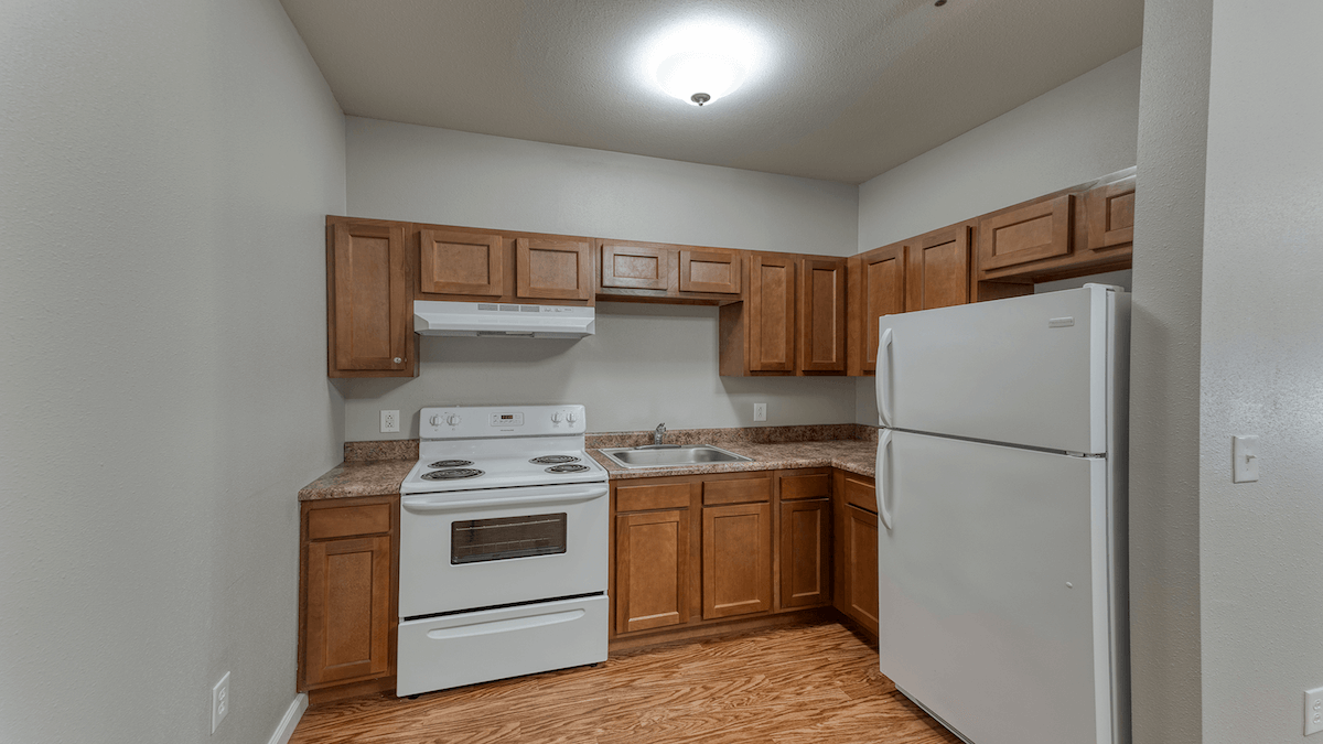 A thoughtfully designed, accessible kitchenette in a senior apartment at Cedarhurst of Breese