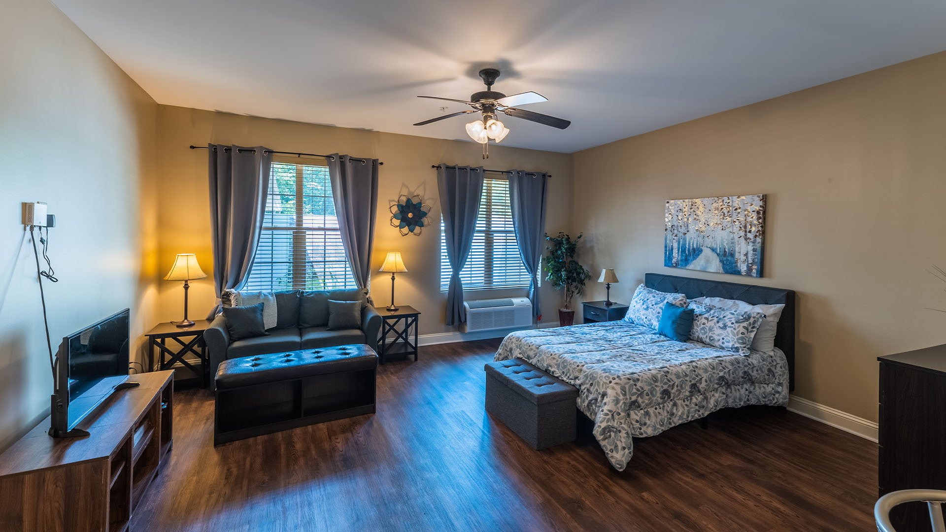 A spacious and bright living room inside a senior apartment at Cedarhurst of Canton