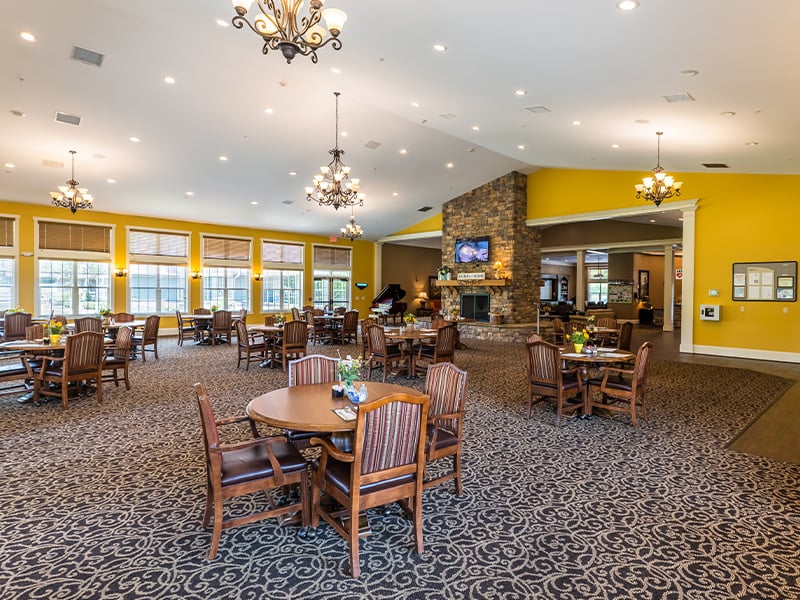 A spacious and bright dining room at Cedarhurst of Canton, offering comfortable seating for meals