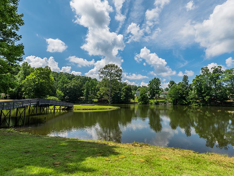 A picturesque view of the lake adjacent to the Cedarhurst of Canton senior living community
