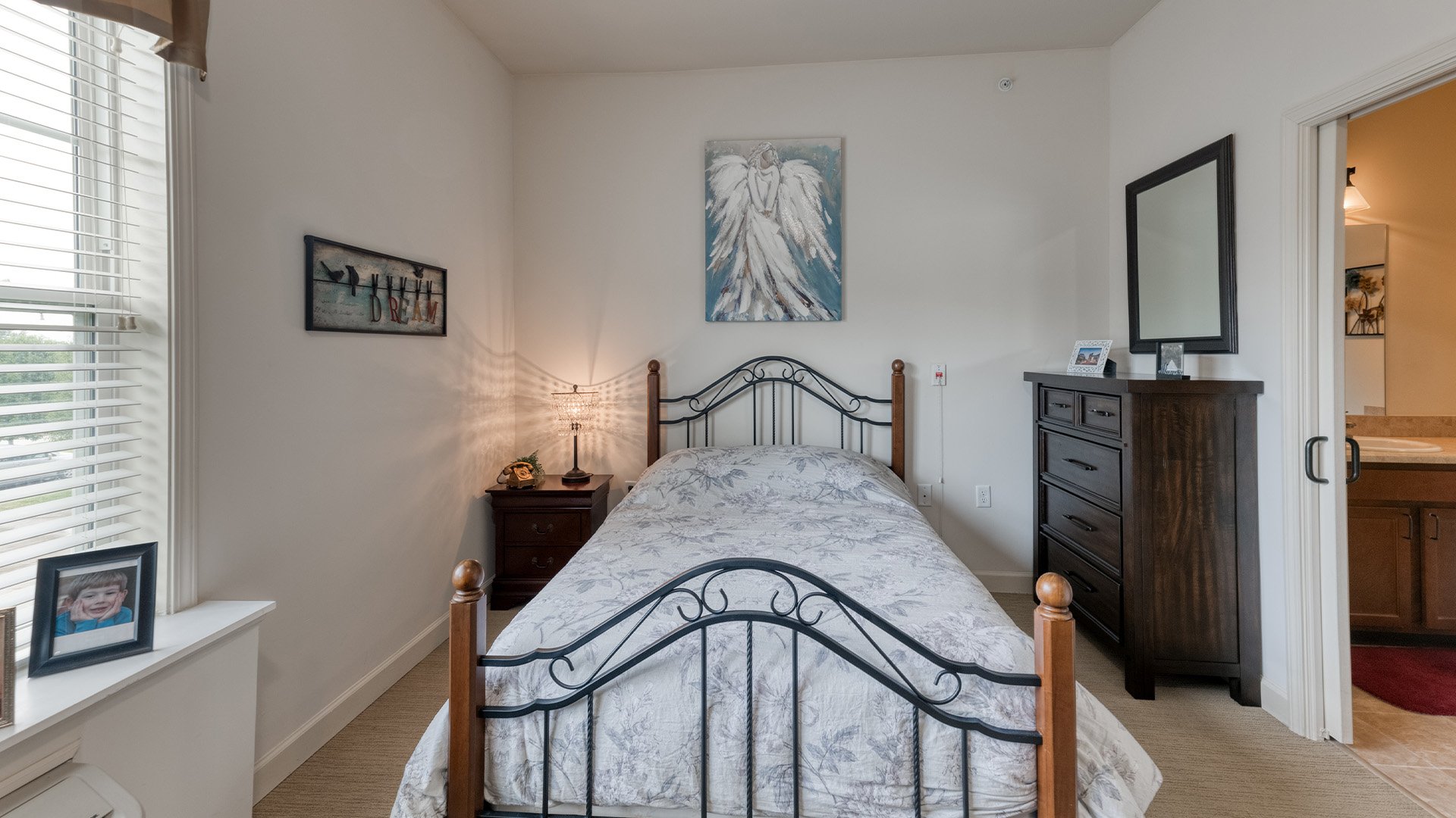 Bedroom of a senior apartment at Cedarhurst of Columbia, designed for resident comfort and personalization