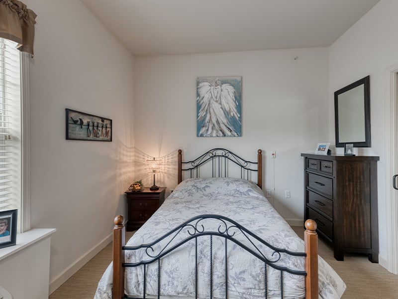 Bedroom of a senior apartment at Cedarhurst of Columbia, designed for resident comfort and personalization