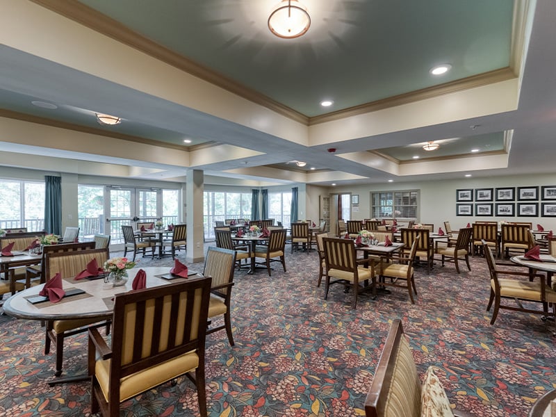 A spacious and bright dining room at Cedarhurst of Columbia, offering comfortable seating for meals