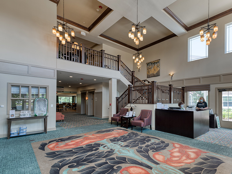 The bright and accessible main lobby at Cedarhurst of Columbia, offering a warm first impression to the senior living community