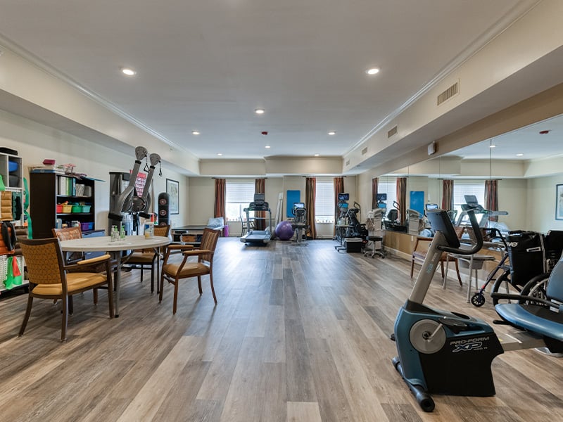 The dedicated physical therapy room at Cedarhurst of Columbia, equipped with accessible equipment for resident rehabilitation and wellness