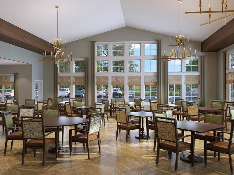 A spacious and bright dining room at Cedarhurst of Crown Point, offering comfortable seating for meals