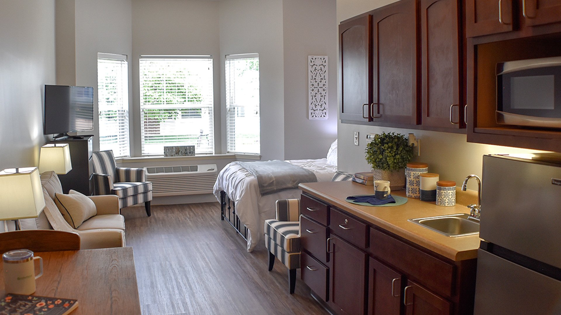 An accessible kitchenette in a senior apartment at Cedarhurst of Des Peres, designed for ease of use and independence