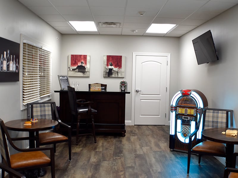 Well-equipped activity room with a juke box at Cedarhurst of Des Peres