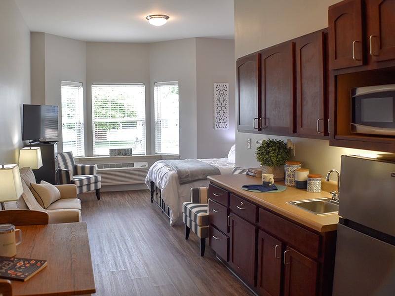 An accessible kitchenette in a senior apartment at Cedarhurst of Des Peres, designed for ease of use and independence