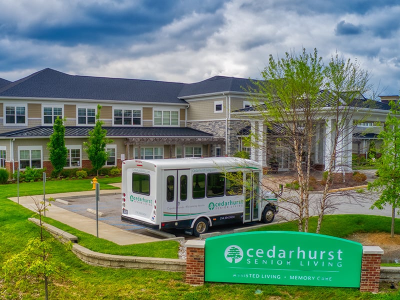 The welcoming front exterior of the Cedarhurst of Des Peres senior living community
